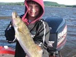 Dylan Grengs fishing with Jarrad Fluekiger. This was Dylan's biggest walleye ever.